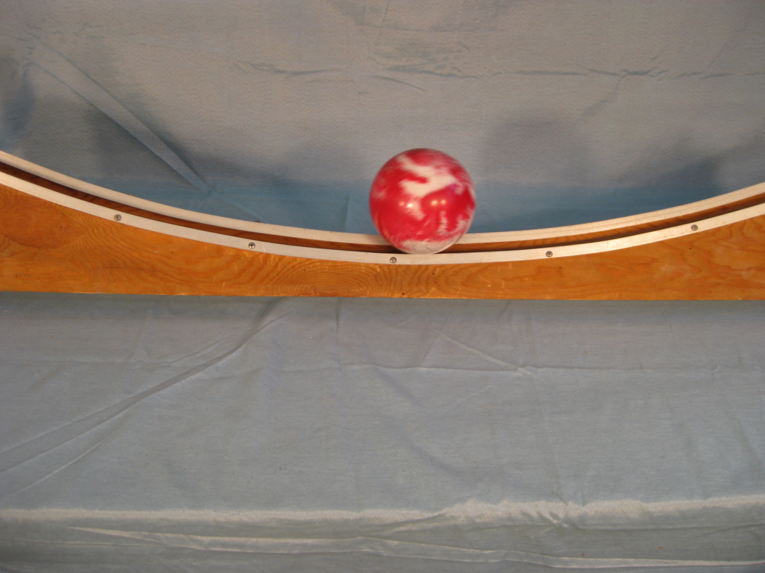 Ball in grooved parabolic track. 1